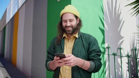 Pleasant Hispanic male using Instagram to like sharing photos of best friends Stock Footage 108427659