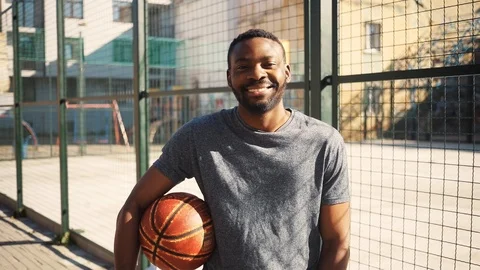 Pleasant-looking African student with beard looking at camera and smiling Video stock 92054703