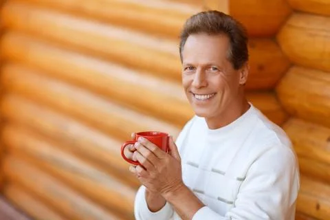 Pleasant man drinking tea Stock Photos