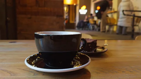 Pleasant setting where aromatic coffee complements variety of sweet indulgences Vídeo Stock 328607239