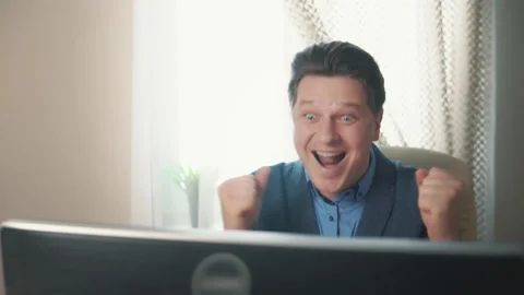 Pleasant surprise of a man at a computer Stock Footage 169647658