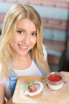 Pleasant waitress waiting at table Stock Photos