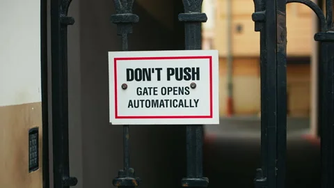 Please be aware Automatic Gate Warning Sign Do Not Push for Your Safety and the Stock Footage 307933418