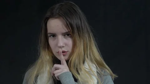 Please, be quiet. Positive teenager girl... | Stock Video | Pond5