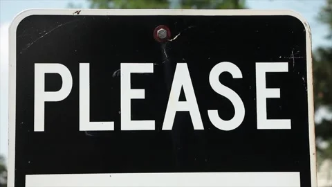 Please caption writing word text metal sign in white capital letters on black Stock Footage 247144744