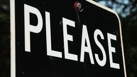 Please caption writing word text metal sign in white capital letters on black Stock Footage 247144769