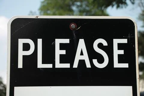 Please caption writing word text sign in white capital letters on black Foto stock