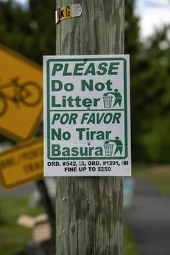 Please do not litter sign on a utility pole near a bike path. Stock Photos