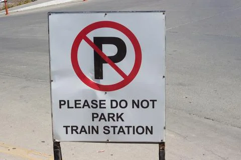 Please do not park train station sign Stock Photos