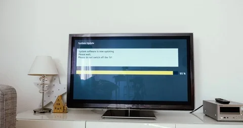 Please do not switch off your tv tv update Panasonic TV update in living room Stock Footage 79403959