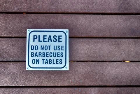 Please do not use barbeques on the table sign Stock Photos
