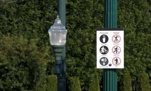 Please do please dont sign next to a street lamp Stock Photos