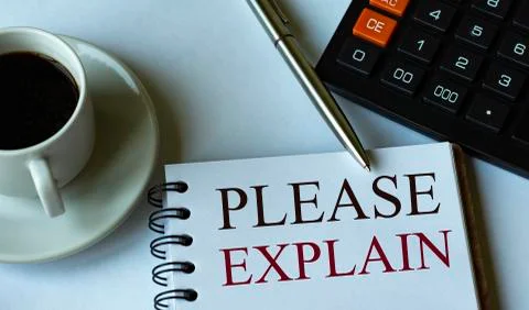 PLEASE EXPLAIN - words written in a notebook against the background of a calc Stock Photos