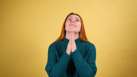 Please god, I'm begging. Upset young woman appealing to heaven with pleading Stock Footage 148423132