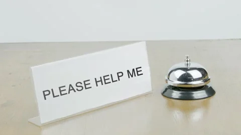 Please Help Me Office or Room with Hand Ringing The Bell on Desk or Table Stock Footage 300789133