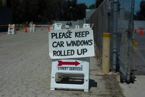 "Please keep car windows rolled up" sign at Covid-19 testing site Stock Photos