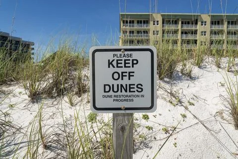 Please Keep Off Dunes, Dune Restoration in Progress signage on white sand w.. Stock Photos