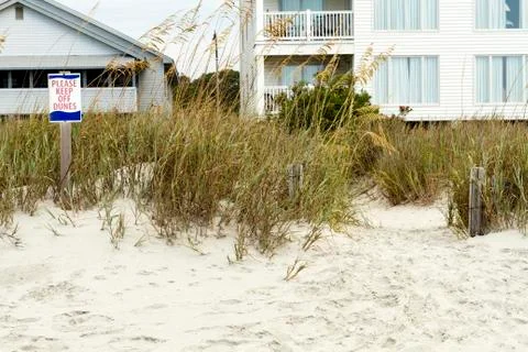 Please Keep Off Dunes Sign and Beach Houses Stock Photos