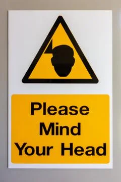 Please mind your head warning sign Stock-Fotos