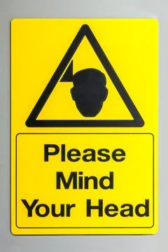 Please mind your head warning sign Stock Photos