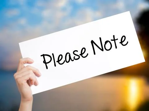 Please Note Sign on white paper. Man Hand Holding Paper with text. Isolated o 스톡 사진