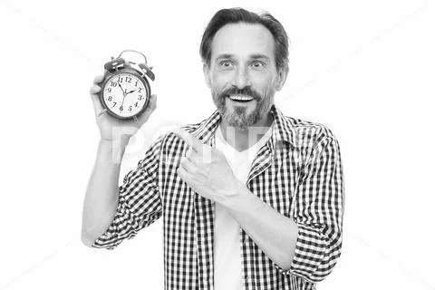Please observe time. Mature man pointing finger at alarm clock. Mature Stock Photos