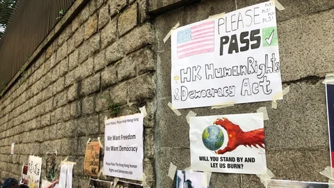 Please Pass Hong Kong Human Rights and Democracy Act Poster at US Consulate Stock Footage 115706811