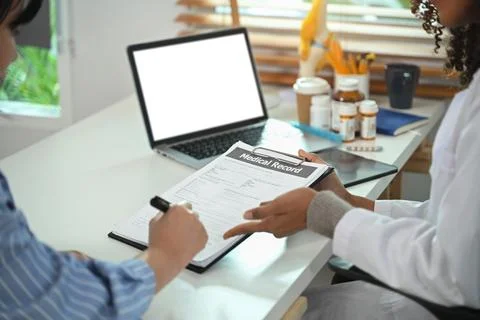 Please sign here, making sure you're will be healthy. Stock Photos