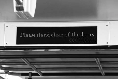 Please Stand Clear Of The Doors caution sign in the TTC subway car of Toron.. Stock Photos