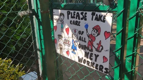 PLEASE TAKE CARE OF ALL KEY WORKERS - FRIENDLY SIGN DURING COVID-19 LOCKDOWN Stock Footage 129095895