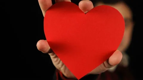 Please like this video. Human hand showing red paper heart in his hand Stock Footage 150741333