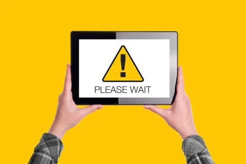 Please Wait Message on Digital Tablet Computer Display Stock Photos
