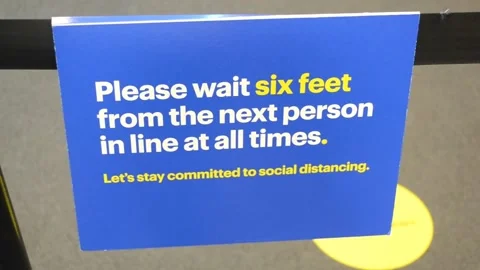Please Wait Six Feet From the Next Person In Line At All Times Signage Video stock 135193405