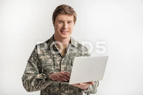 Pleased male officer surfing the internet Stock Photos