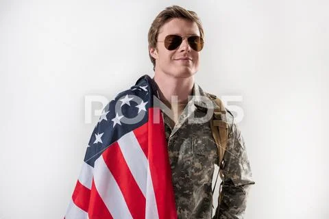 Pleased military man is proud of his country Stock Photos