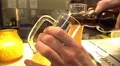 Pleased pub visitor pouring bottled beer into glass, weekend relaxation, holiday 4k or 4k+ Resolution