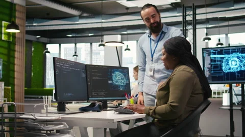 Pleased startup office manager applauding female programmer for optimizing code Stock Footage 313016037