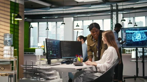 Pleased supervisor praises junior dev work, fostering positive office culture Stock Footage 313018361
