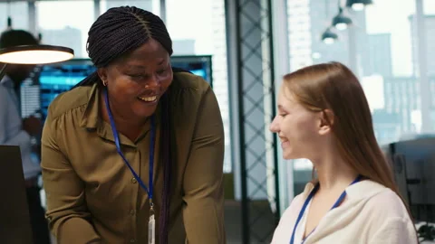 Pleased supervisor praises junior dev work, fostering positive office culture Stock Footage 313165160