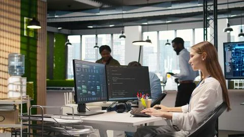 Pleased supervisor praises junior dev work, fostering positive office culture 写真素材