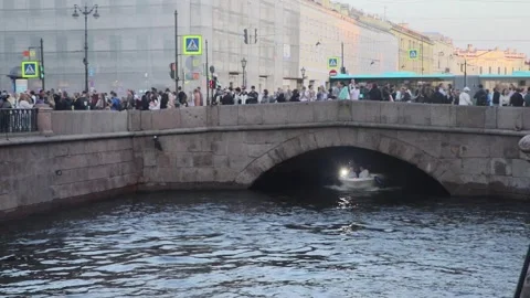 Pleasure Boat with a flashlight Swims Under A Very Low Bridge.St.Petersburg,Rus Stock Footage 313453659