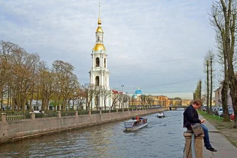 Pleasure boats float around the bell tower of St. Nicholas naval Cathedral in Stock Photos