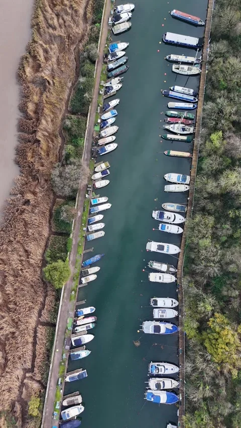 Pleasure craft on Gloucester and Sharpness canal. Adjacent is the River Severn. Stock Footage 293681663