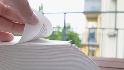 Pleasure of Reading. White woman's hand flipping through the book. Stock Footage 247073734