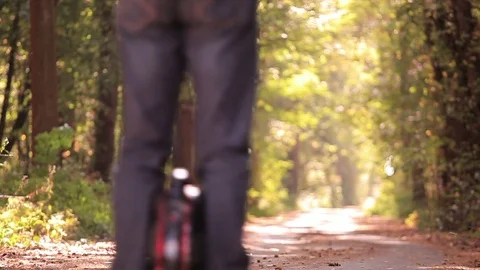 Pleasure of riding. Man with mono wheel in autumn park road hands raised up. Stock Footage