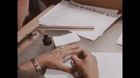 PLEIKU - 1969: Leaflet artwork - Hands inking artwork at a drafting table Vidéo 343934293