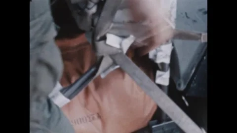 PLEIKU - 1969: Leaflet drop - Cartons spill printed sheets by a chute frame Stock Footage 343934381