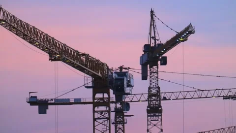 Plenty of cranes working on the mega construction in Saudi Arabia on the sunset Stock Footage 285326354