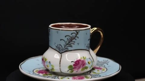 Plenty of sparkling coffee in a 360 degree rotating design cup Stock Footage 248564564