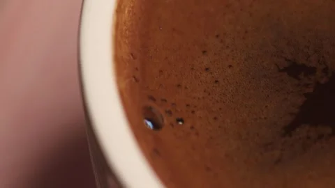 Plenty of sparkling coffee in a 360 degree rotating design cup Stock Footage 248564622